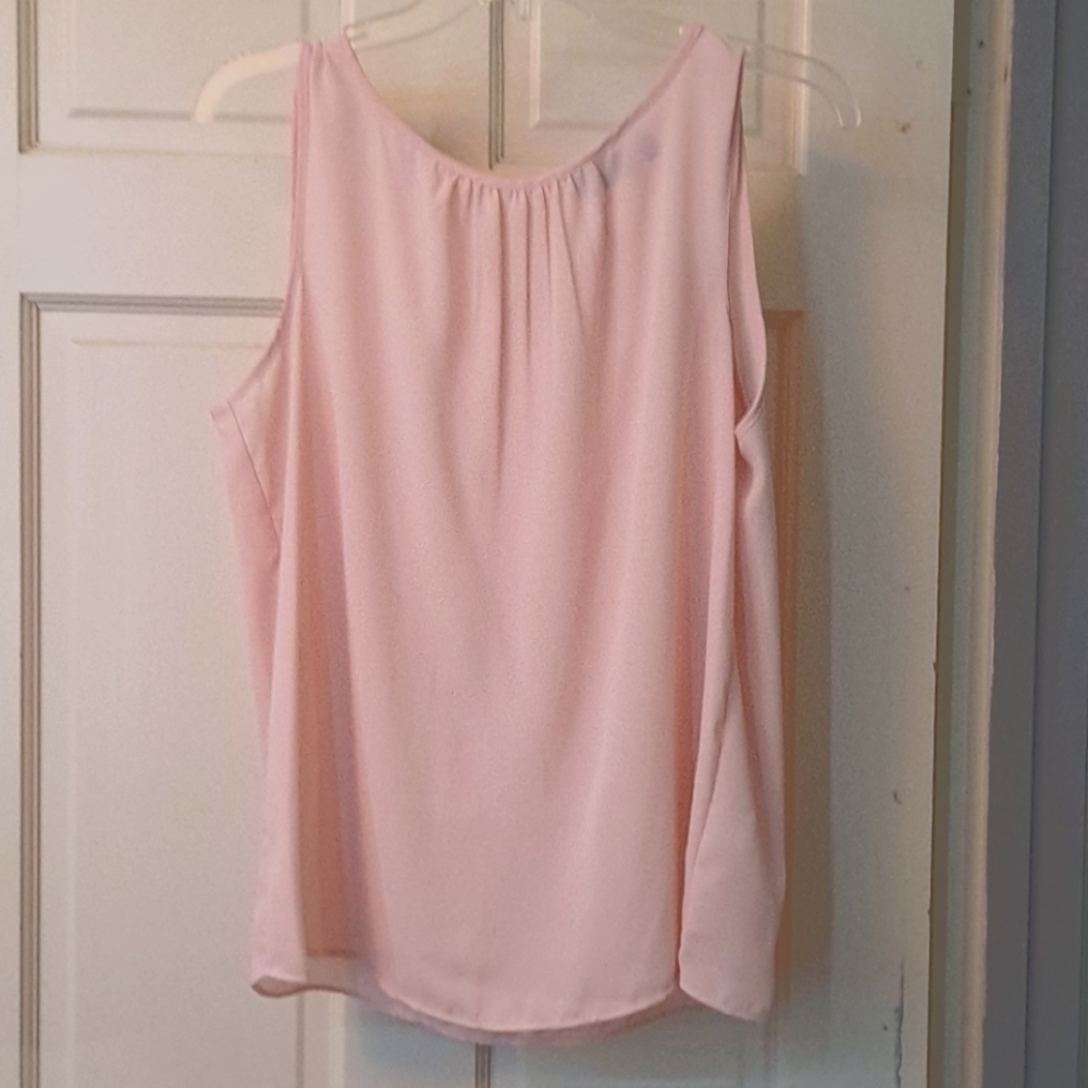 Pretty light pink sleeveless blouse.